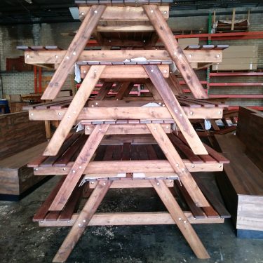 A-Frame 1500 Kwila Outdoor Timber Picnic Setting stacked ready to ship!